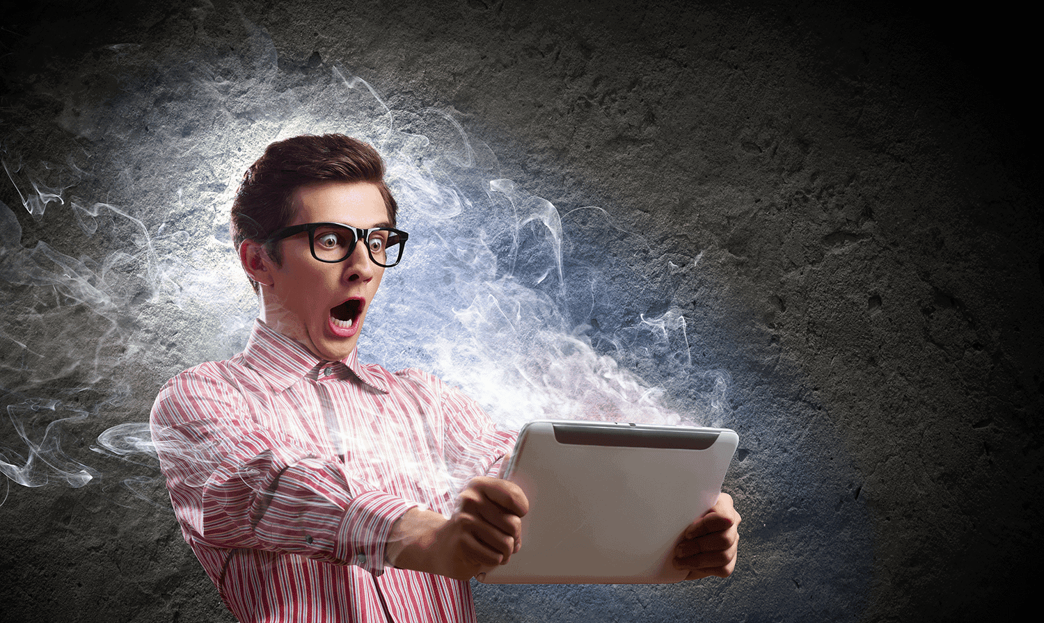 Clickbait - a surprised man holding a tablet smoking